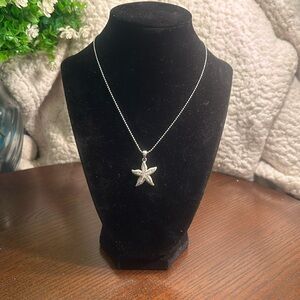 Silver-tone necklace with rhinestone starfish pendant